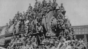 A train with a huge group of people sitting on it