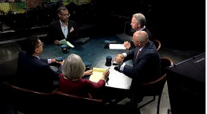 A group of people sitting around a table.