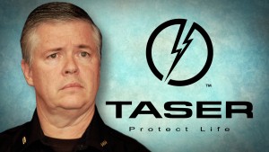 A man in a police uniform with the words taser protect life.