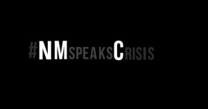 A black background with the words nm speaks crisis.