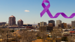 The city of Albuquerque with a purple ribbon for Domestic Violence over top.