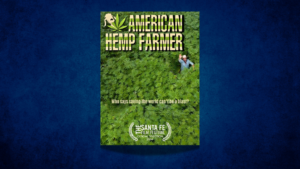A book cover titled "American Hemp Farmer" shows a man in a field of hemp plants. The text reads, "Who says saving the world can't be a blast?" and includes a Santa Fe Film Festival official selection logo.