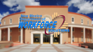 The image shows the New Mexico Department of Workforce Solutions logo superimposed on a building with an adobe-like exterior and a curved front facade under a partly cloudy sky.