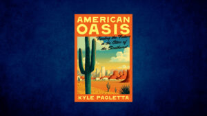 Cover of the book "American Oasis" by Kyle Paoletta, featuring a cactus and desert landscape with buildings in the background, set against an orange and yellow sky.